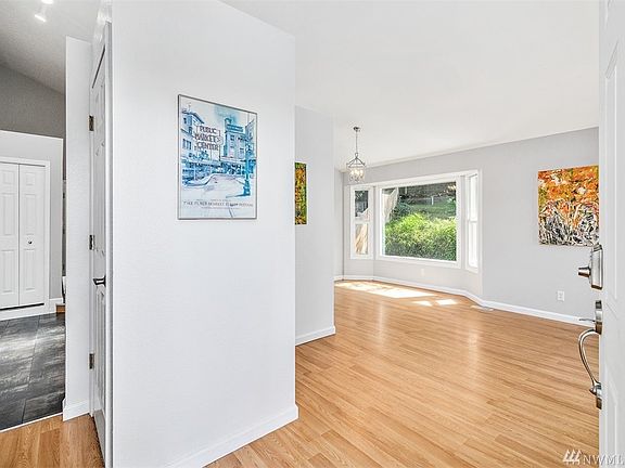 Spacious entry to this Recently Updated Home - Living and Dining Rooms to the right, Kitchen and Family Room to the left.