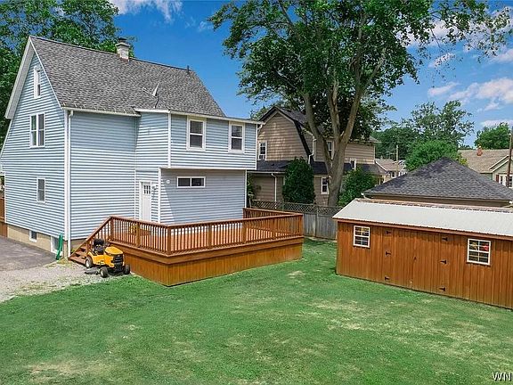 Part of backyard, big shed, and deck.
