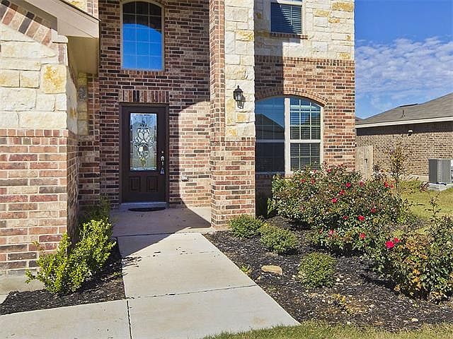 Front entrance with and landscaping