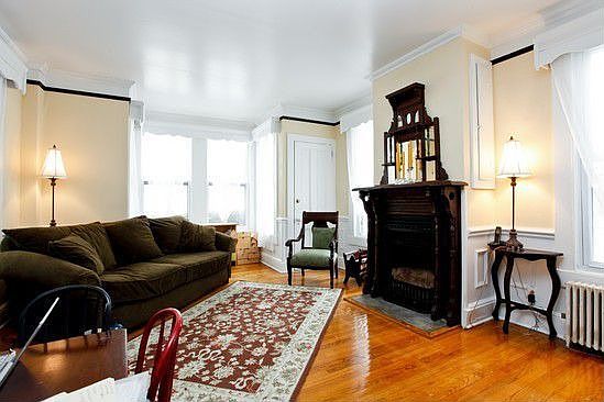 Family room with windows everywhere and elegant hearth