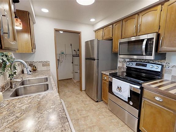Updated kitchen! New stainless steel appliances, counter tops and lighting!