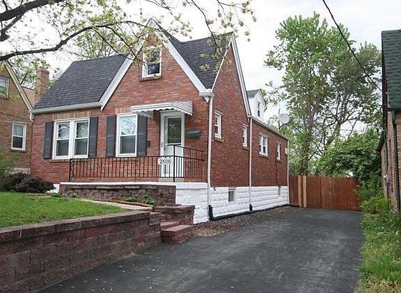 Brick 1.5 story, has ample driveway to park several cars.  Newer roof, front door with decorative leaded glass insert, storm door, vinyl thermo windows throughout, and privacy fence.