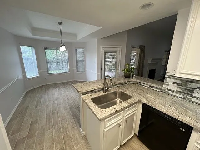 kitchen and dining area, all new granite, sink, tile floors