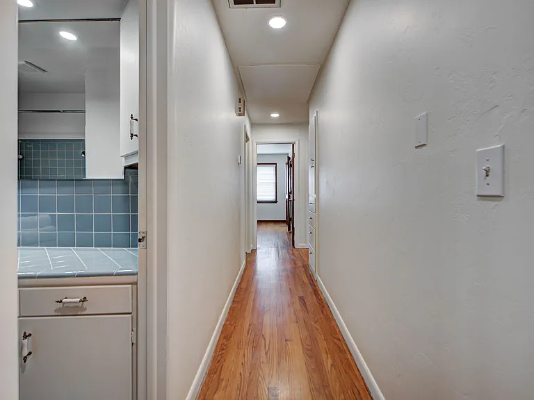 Hallway Leading to Bedrooms and Guest Bathroom