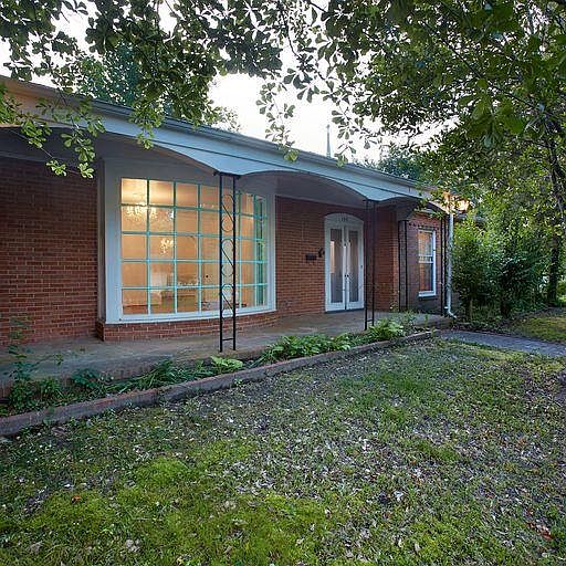 Front entrance to the house; large window in the picture is the living room.