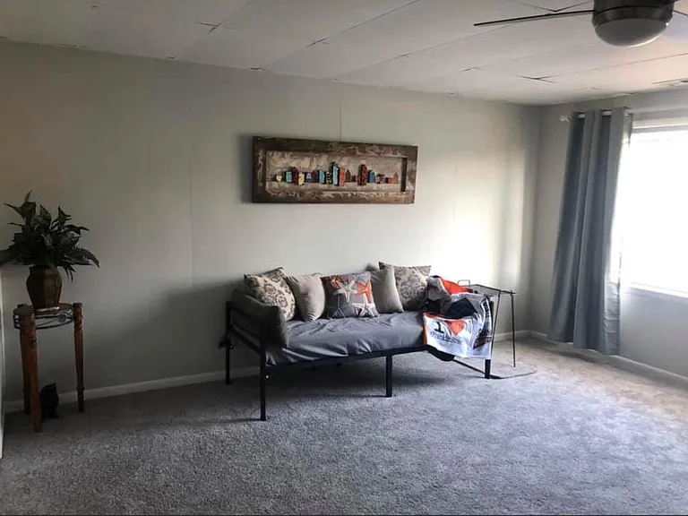 Large living room with closet for extra storage. Plenty of light comes thru the large front window.