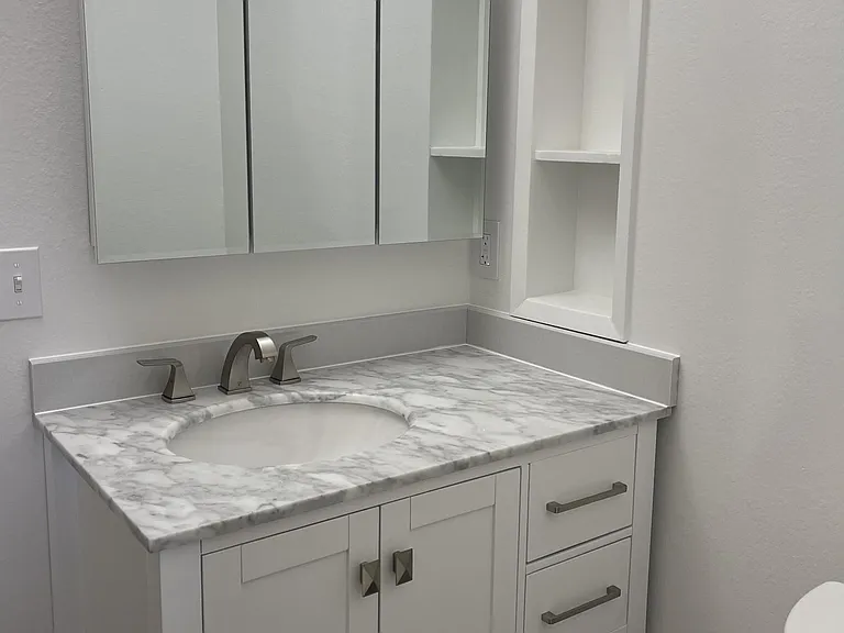 Clean and refreshed bathrooms, including a convenient half-bath.