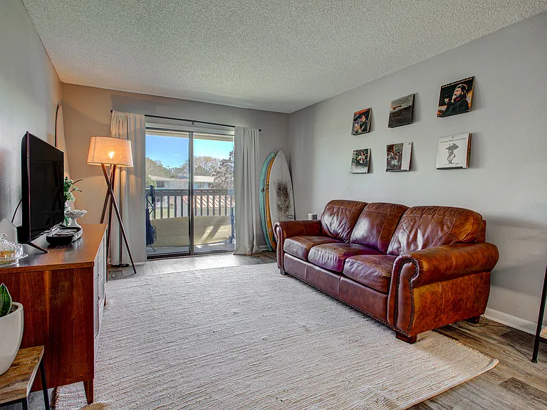 Living room with sliding glass door to balcony