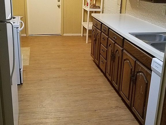 Kitchen view toward laundry area/carport