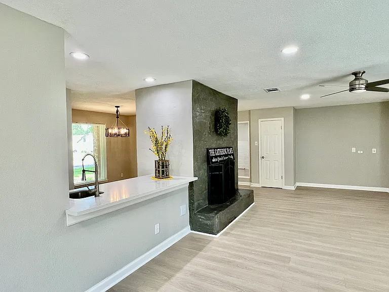 View of the fireplace and the wet bar from a different angle