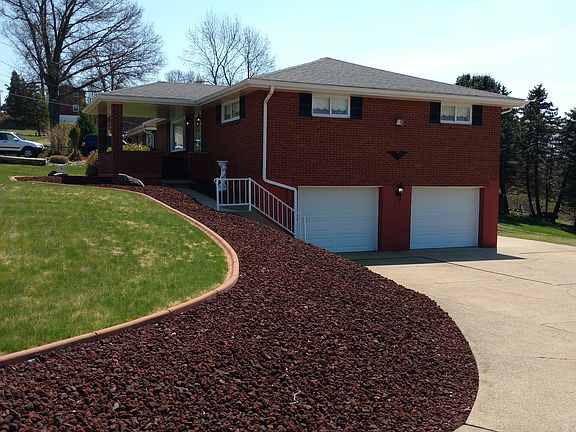 Paved driveway & 2 car garage