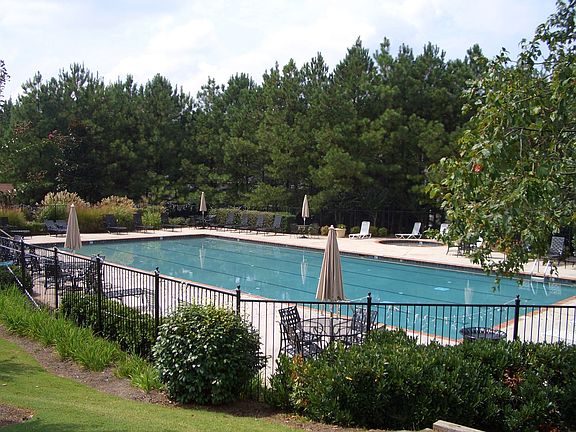 Welcoming Swim/Tennis community features beautiful pool.