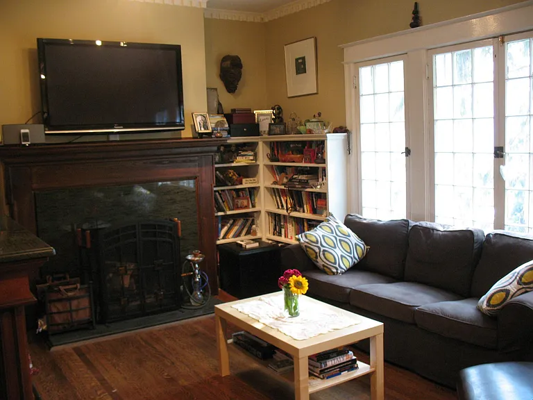 living room with active fireplace