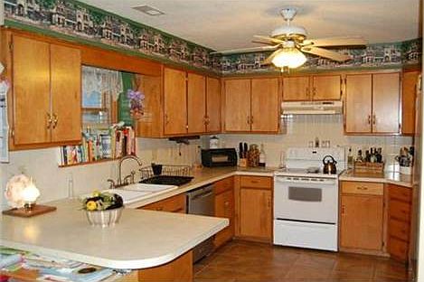 Well laid out kitchen with tile flooring.