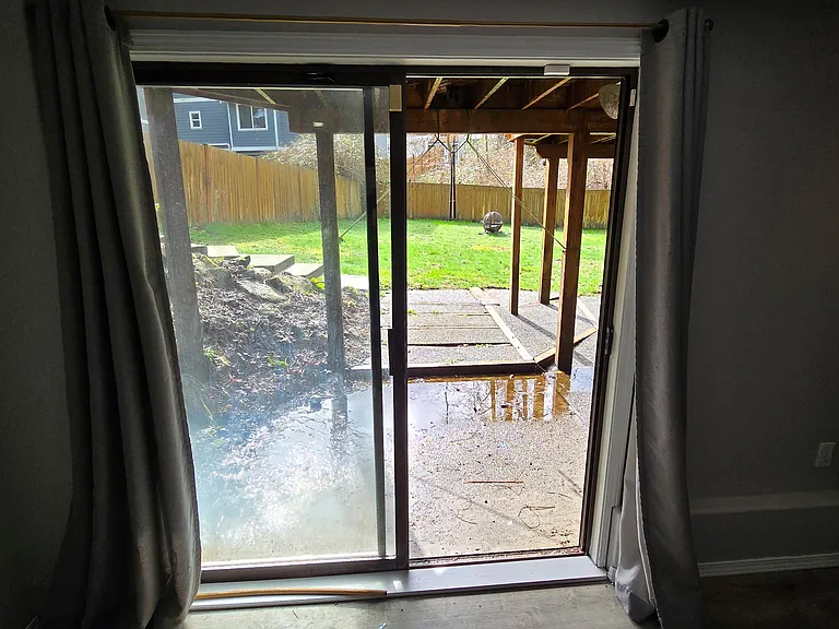 Lower level sliding door leading to backyard