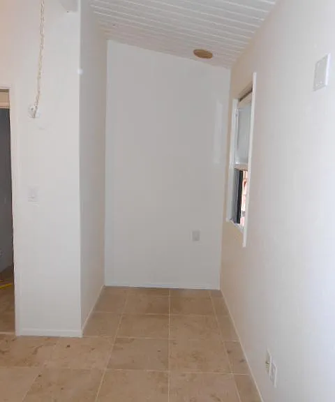 Nook off of bedroom with limestone floors