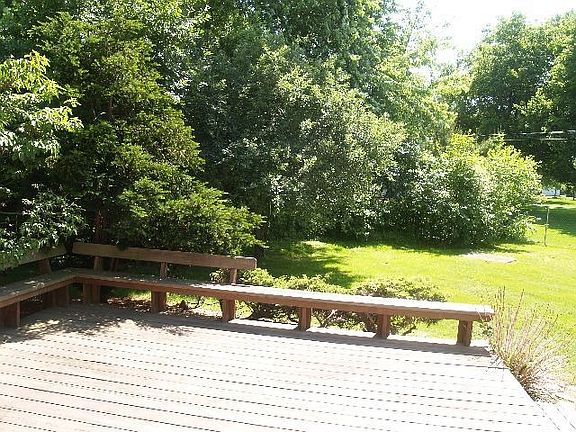 Deck overlooking fenced back yard