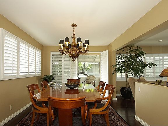 The dining area can comfortably seat 16 and opens out to a covered balcony.