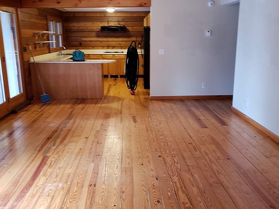 View to kitchen from living/dining. Back porch doors and the lake on the left.