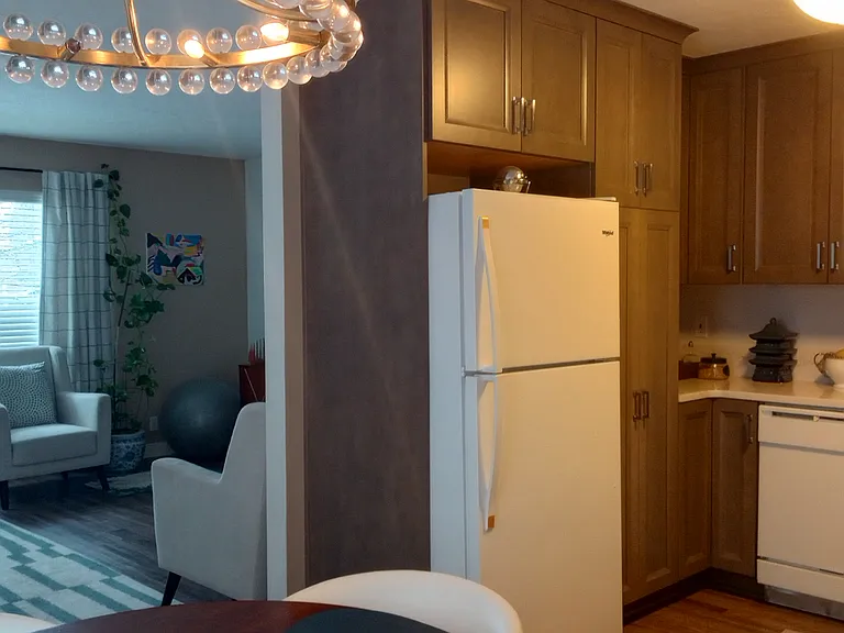 Kitchen, Staged with view of living room in background.