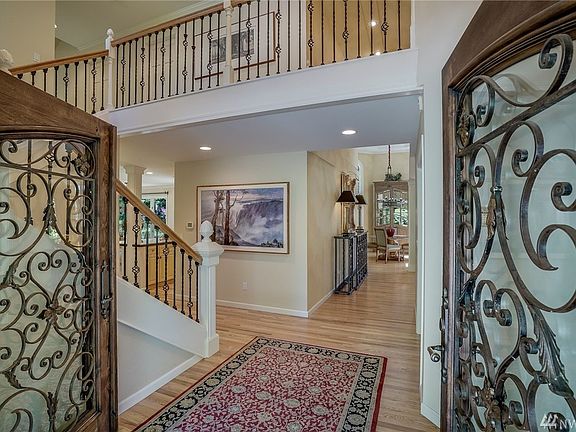 Easy living traffic pattern. Gleaming refinished hardwoods. Iron spindled stairway with finial accents. 