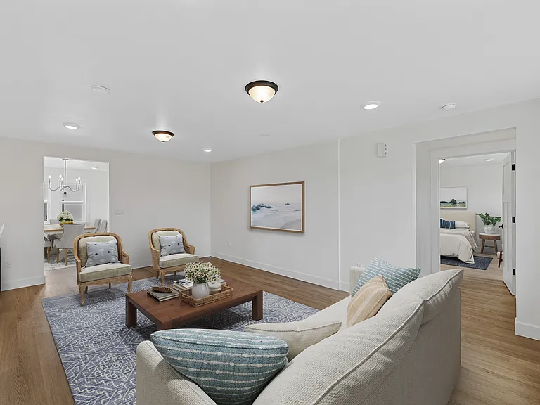 View from formal living to the front entry and through to the versatile family room or second primary suite - however you choose to use it!