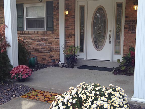 Covered porch invites you in