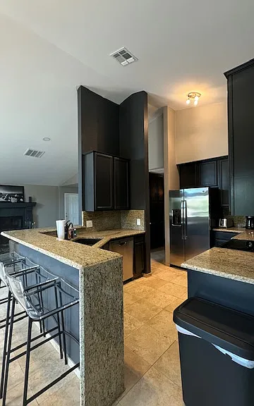 FURNISHED. Kitchen and bar.