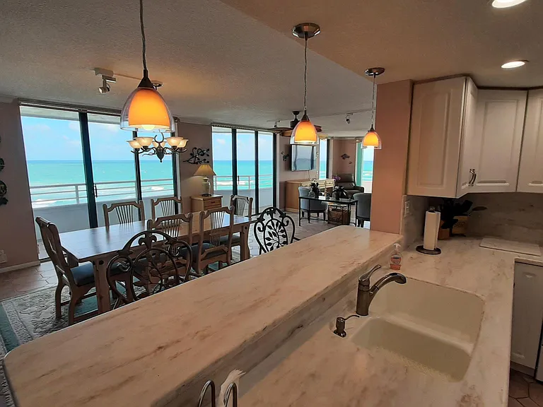Pendent lights and chairs at Kitchen Counter