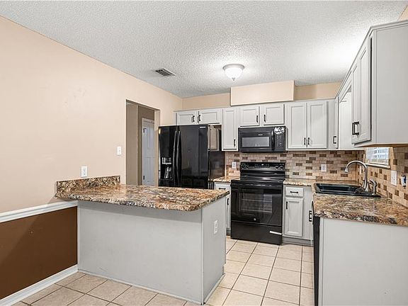 5th image of 6332 Woodside Dr N