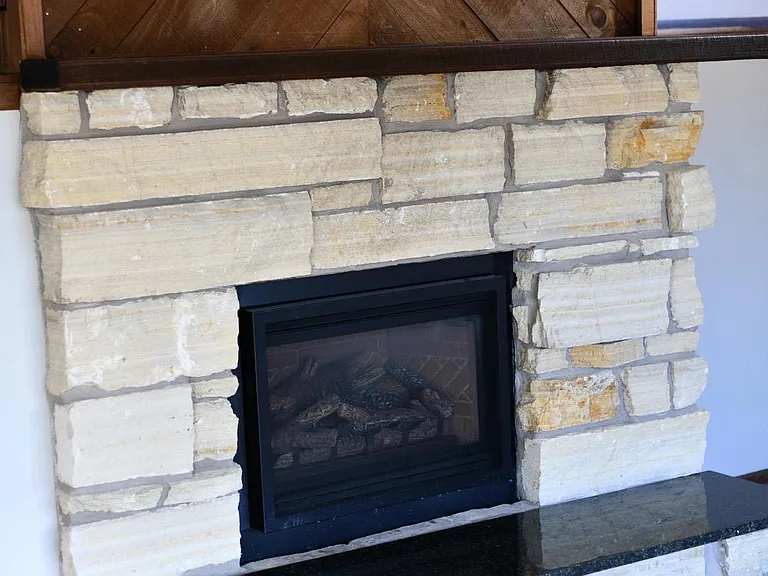 Fire place with granite counter.