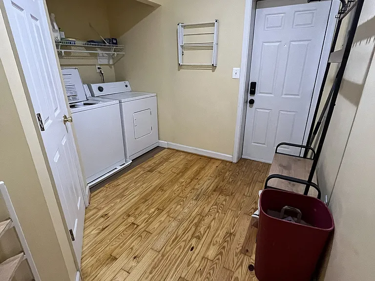 Back mudroom area with utilities and half bath