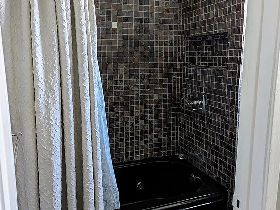 Master bath shower and toilet room with jetted tub