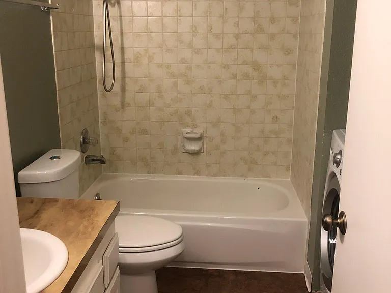 Bathroom with washer and dryer