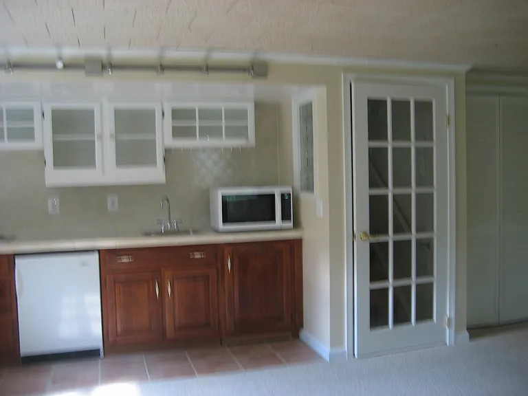 Kitchenette-partial view. Fridge. Convection/microwave oven