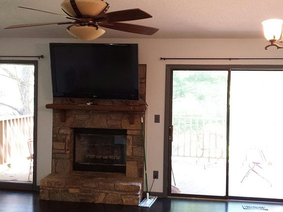 Living room with big screen tv and fireplace