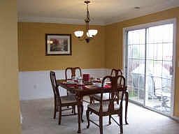Formal dining room with BRAND new chandelier, crown and chair rail moulding!