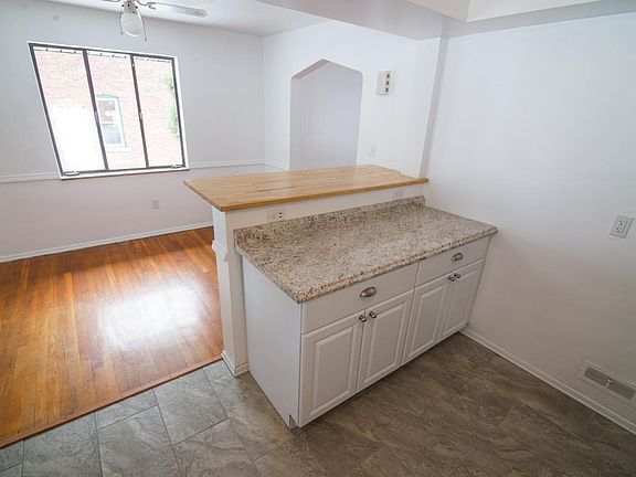 Open kitchen layout leading into dining room