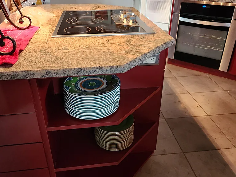 The kitchen from in front of the wine refrigerator.