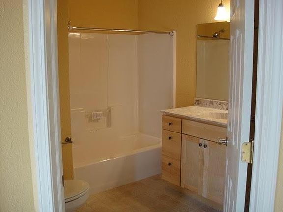 Spacious bath with large vanity and mirror with a lot of storage space