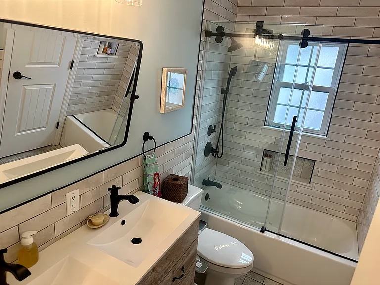 Full bathroom with two sinks