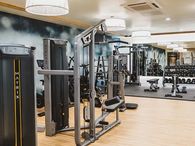 Fitness studio featuring cardio and weight stations
