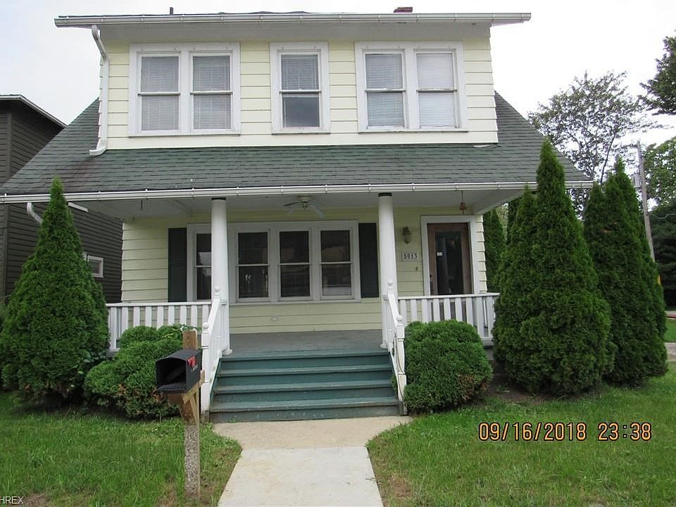Welcome to 5013 New St., Geneva on the Lake. Imagine hearing the waves of Lake Erie as you sit on this charming front porch.