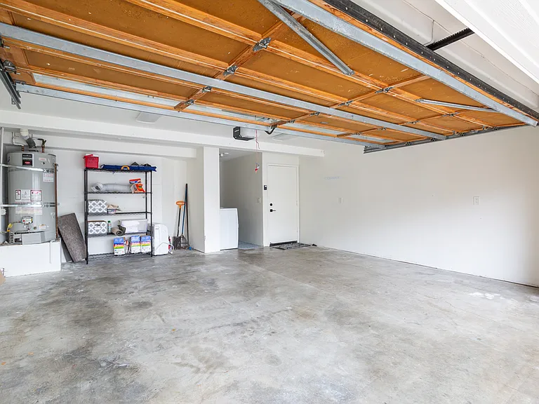 Large garage with washer / dryer (currently has a ping pong table in one stall) so one spot in garage and 2 parking spots off street in front of the garage.