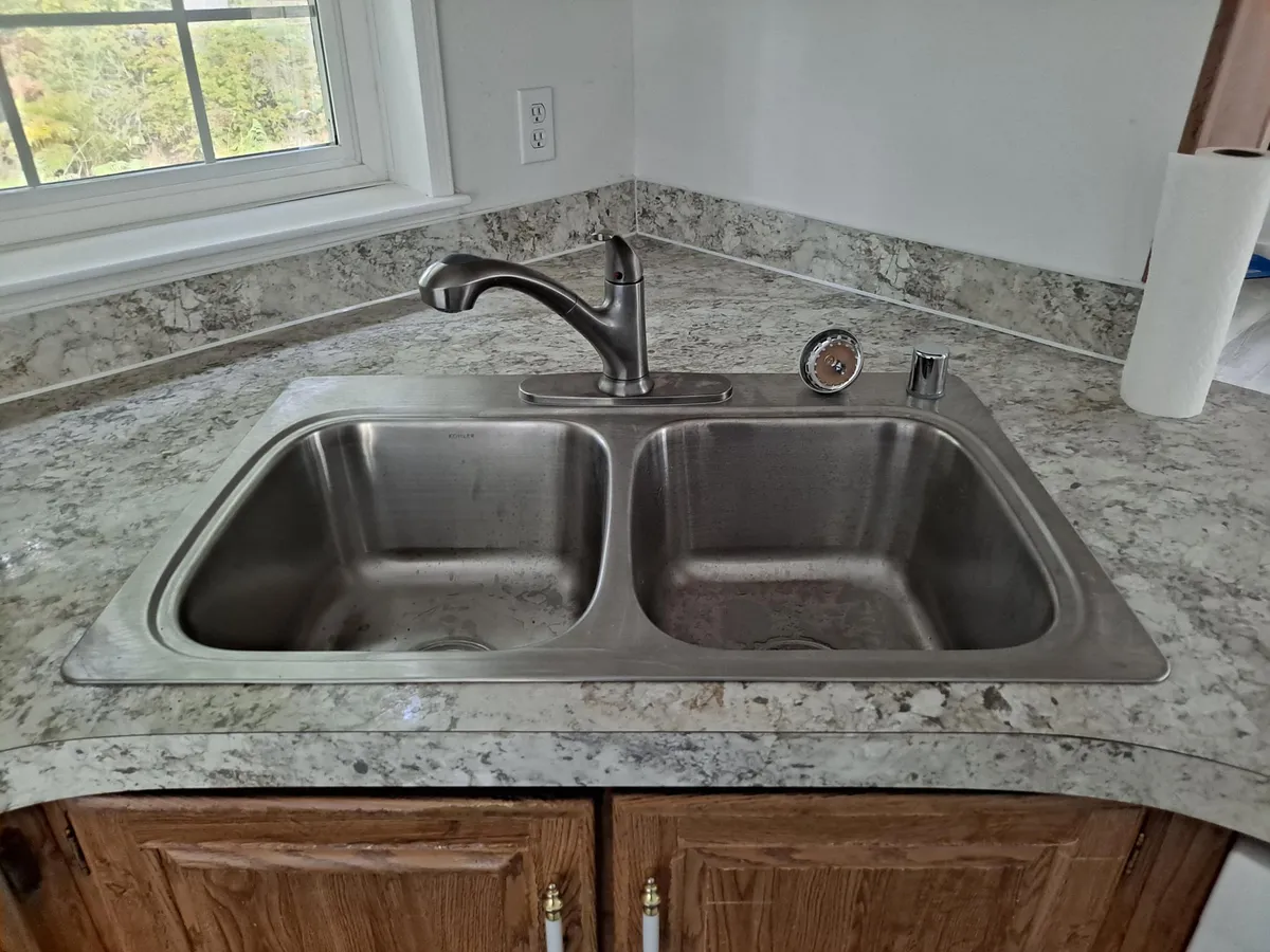 Brand new kitchen sink and new counters. - 10183 Tommy Pl NE