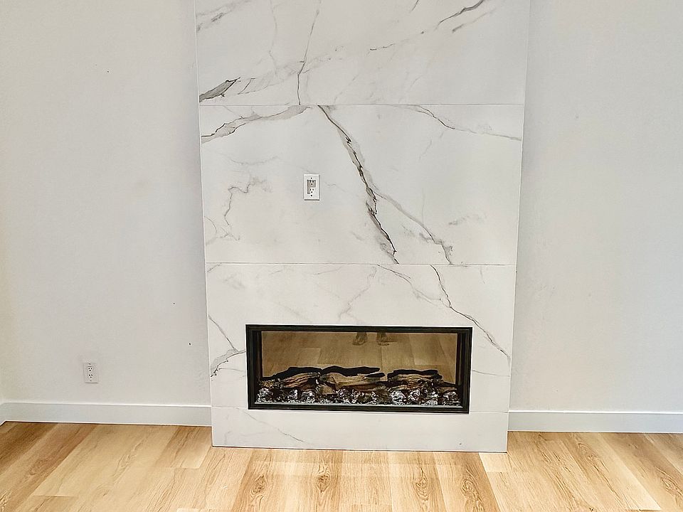 Unit #112 fireplace in living room with gorgeous stone surround!