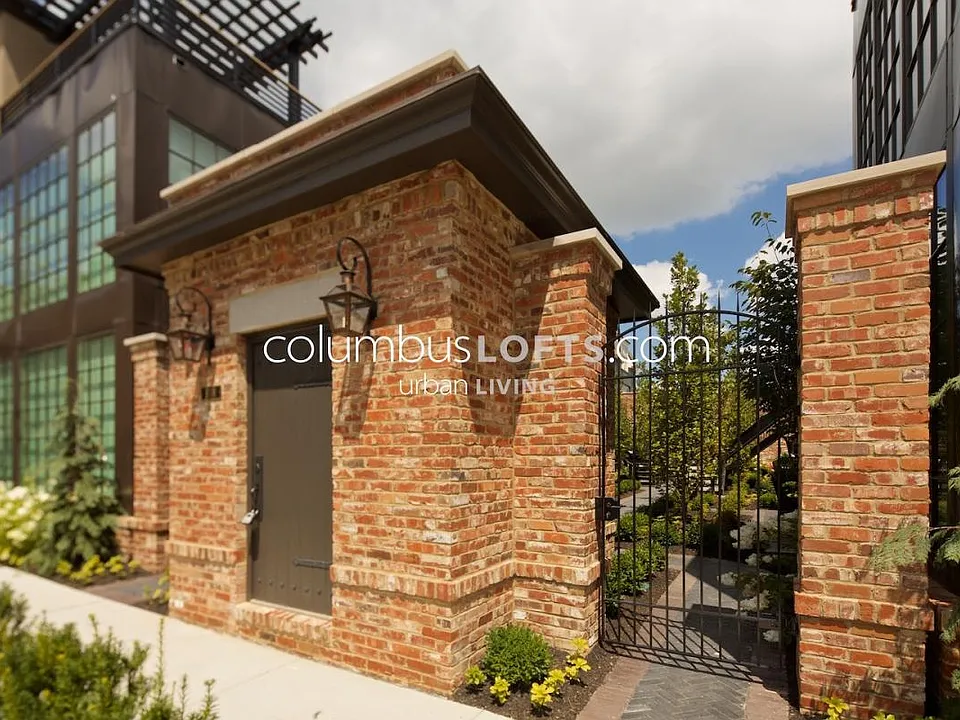 Exterior gated entrance to courtyard where condo unit is located.