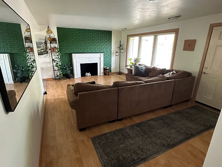75" Flatscreen TV is currently installed above the fireplace but not pictured.