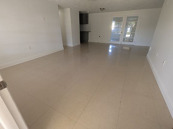 As you enter the front door. Kitchen to your left, bonus room straight and extra room to the right.