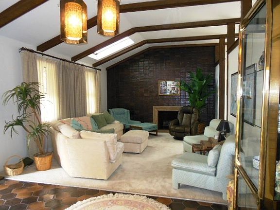 Spacious living room with a marble fireplace